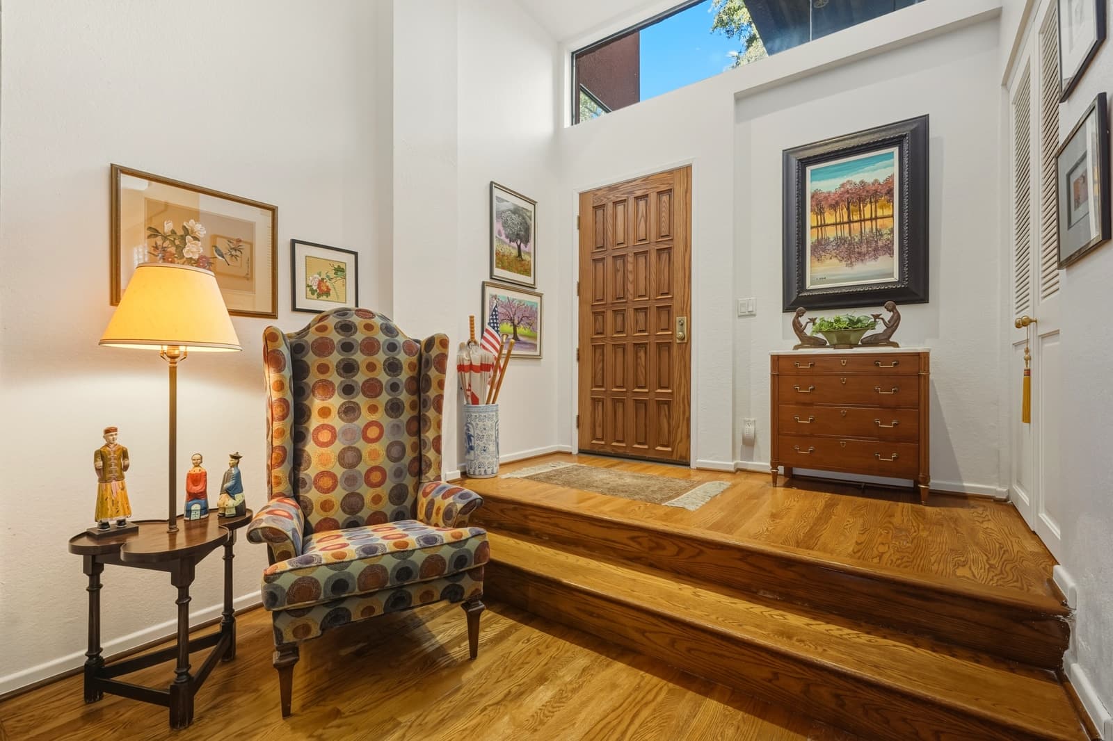 Traditional foyer with a wood door in a Pasadena listing, photographed by VVT